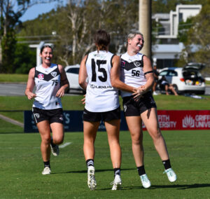 Southport Sharks Reserves celebrate a goal.