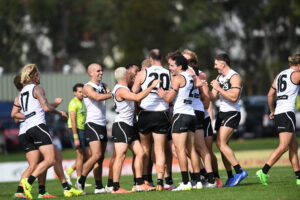 Sharks players celebrate a goal.