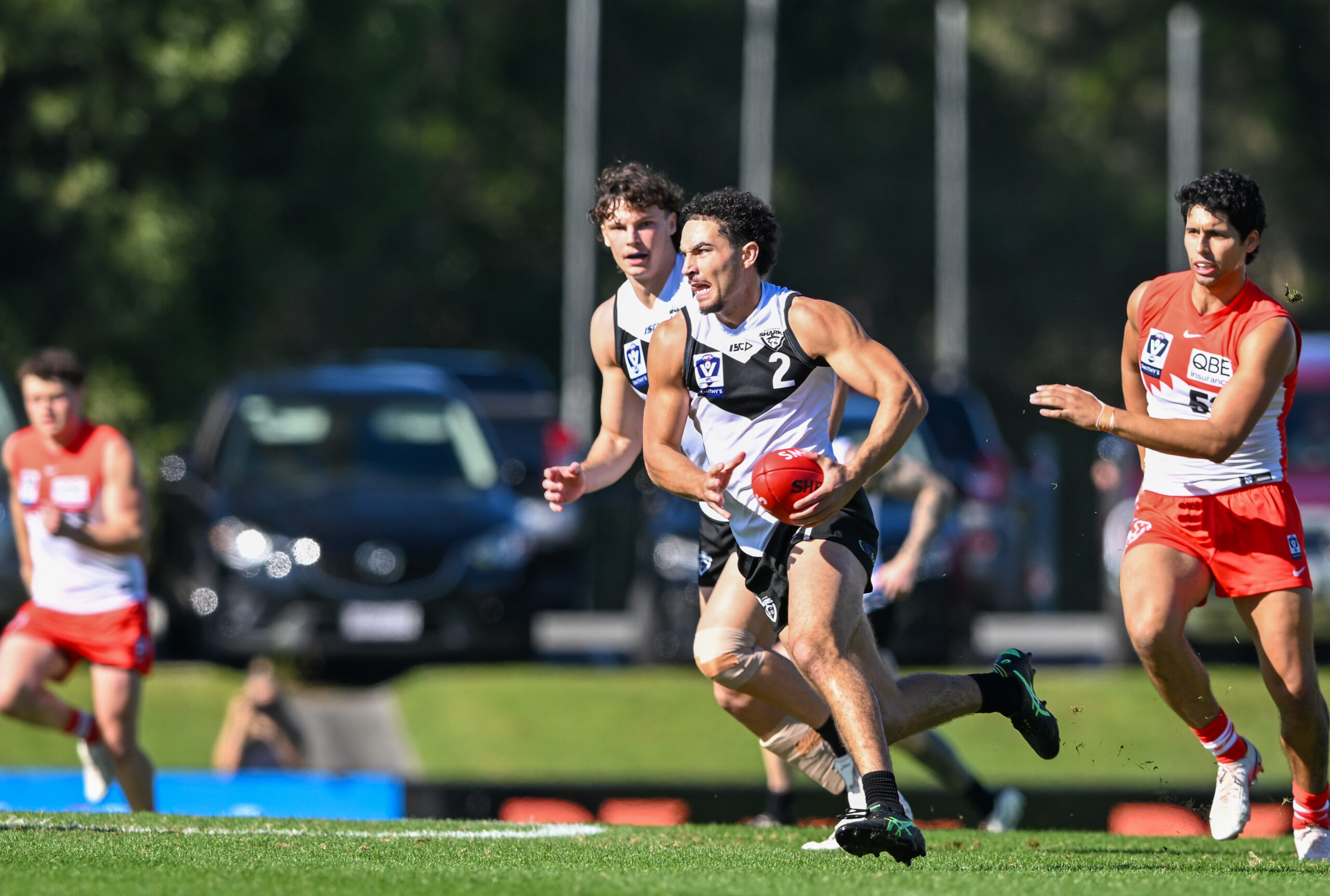 Swans pull away from Sharks despite spirited effort