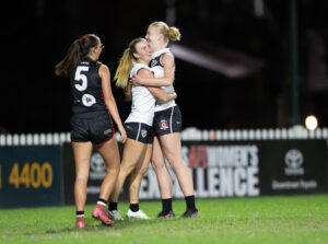 Sharks players celebrate a goal.